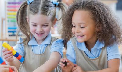 young girls playing with blocks